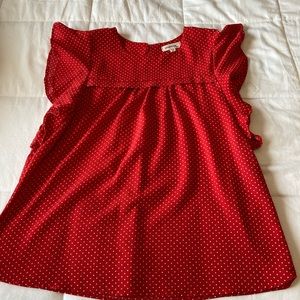 Red with white polka dot blouse